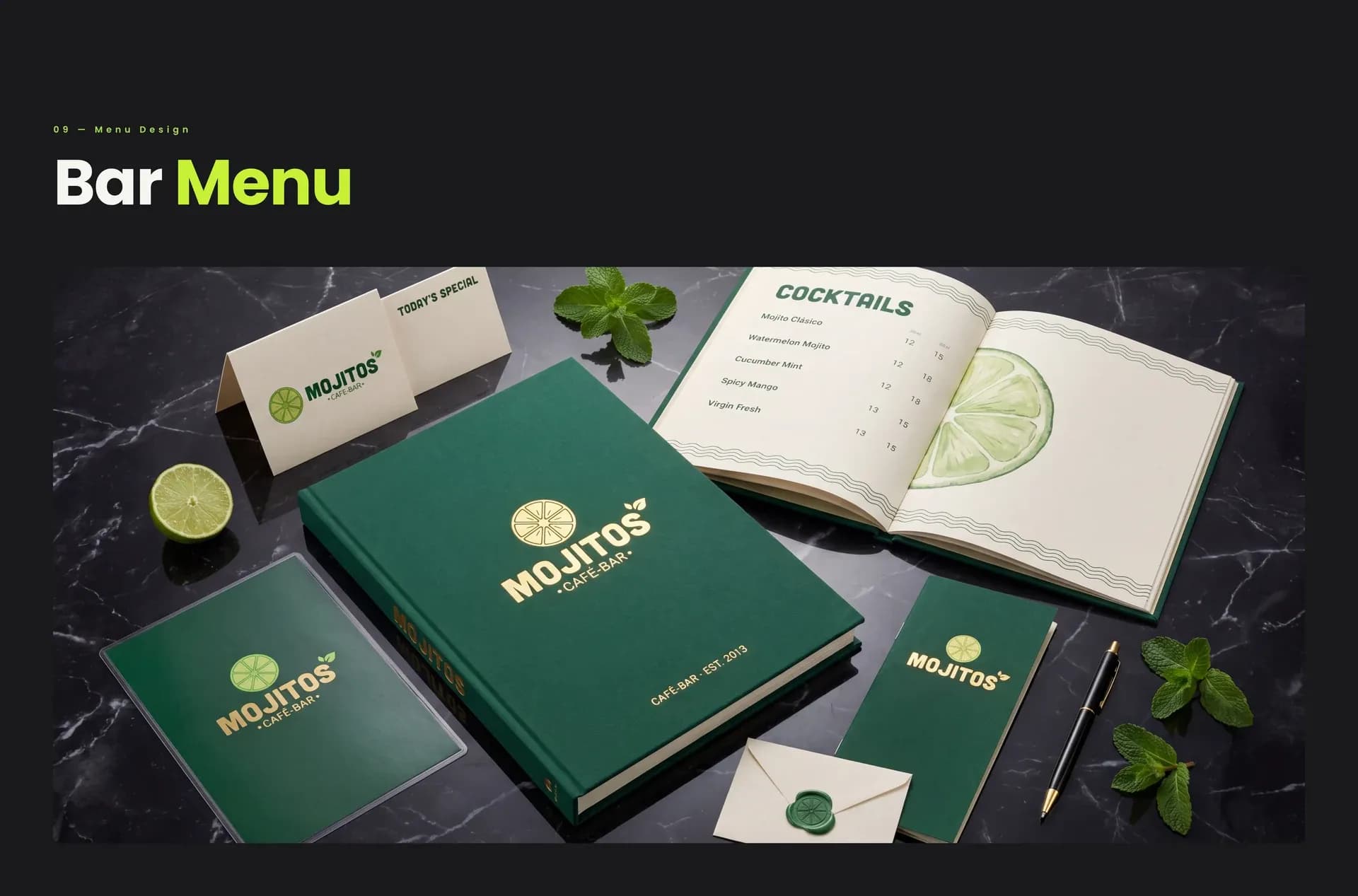 MOJITOS bar menu and branded stationery on a marble table